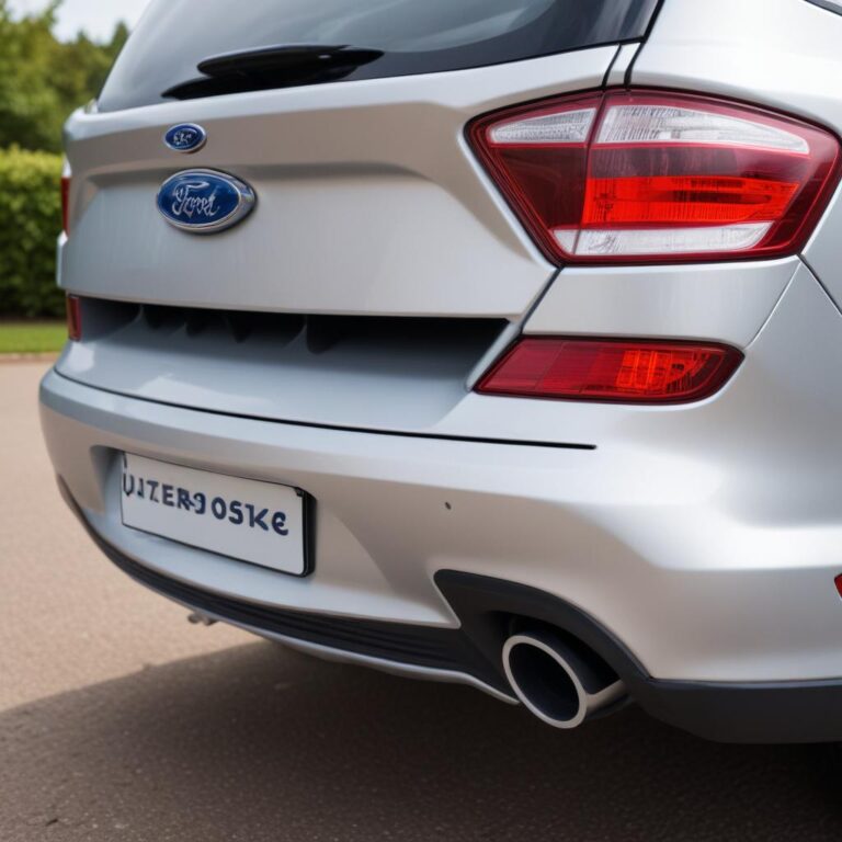 Inspecting the rear parking sensors on a Ford bumper